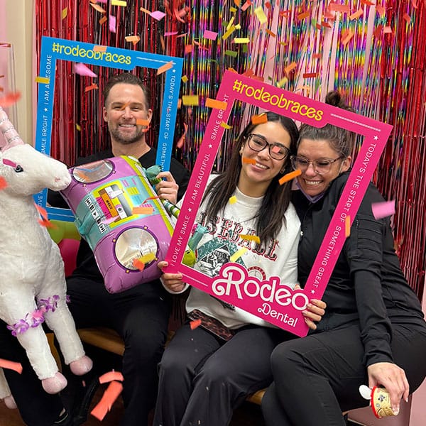 Rodeo Dental orthodontics team with happy patient