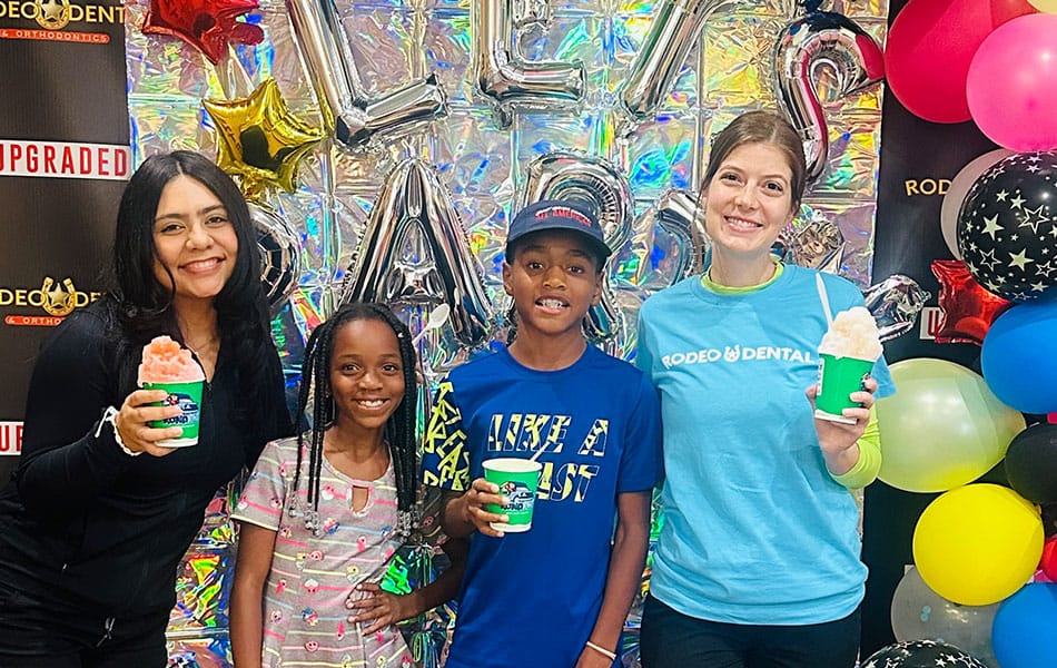 Teen with colorful braces bands during orthodontic visit